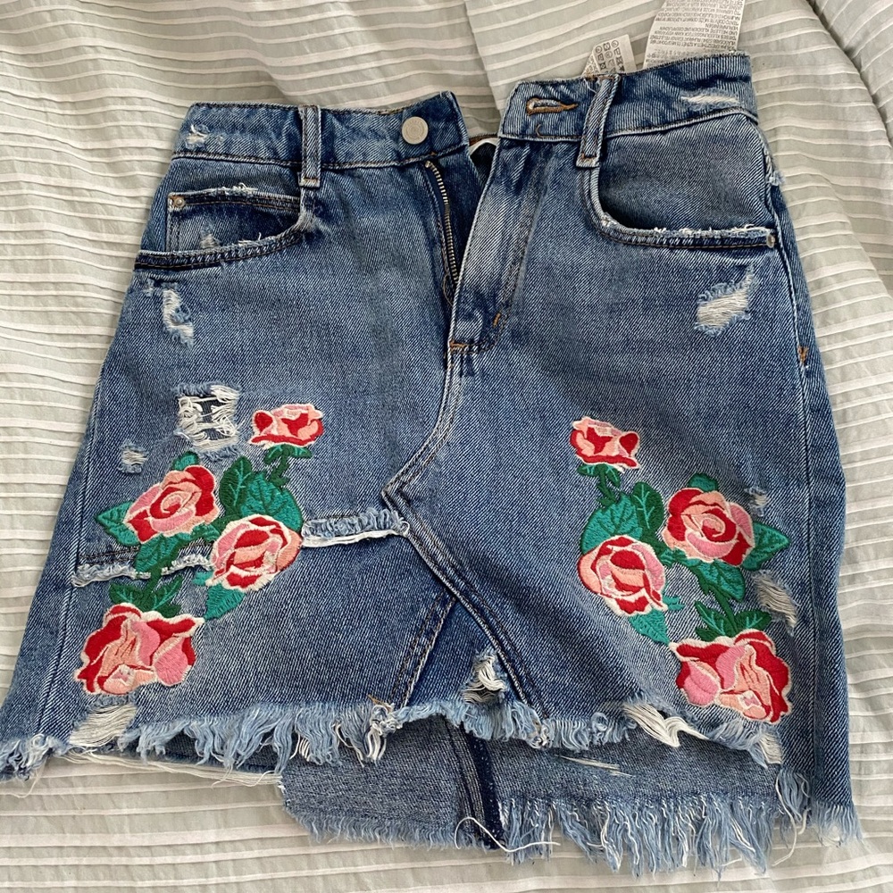 ripped denim skirt with roses